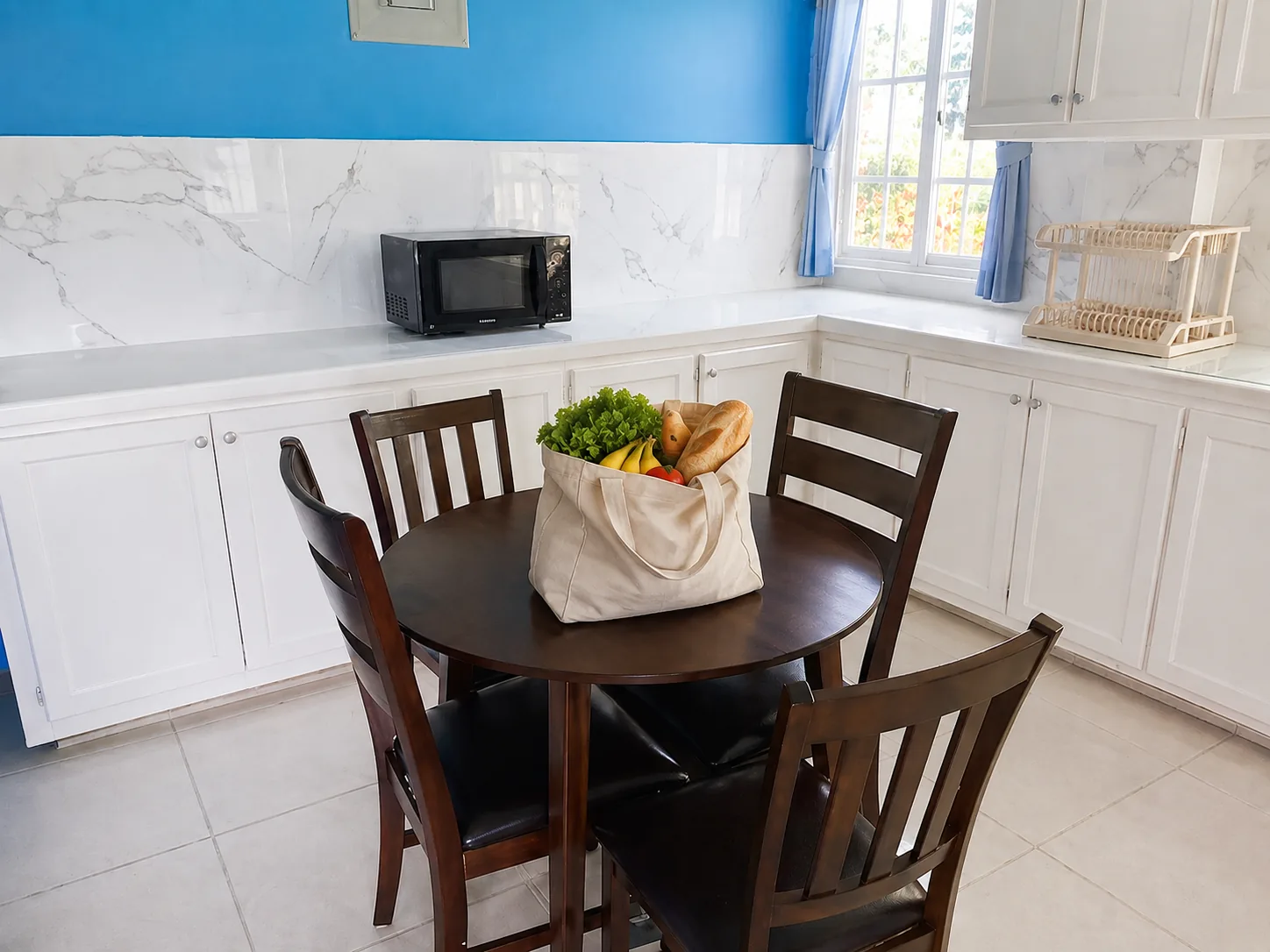 A bag of groceries set down on the kitchen table in the apartment