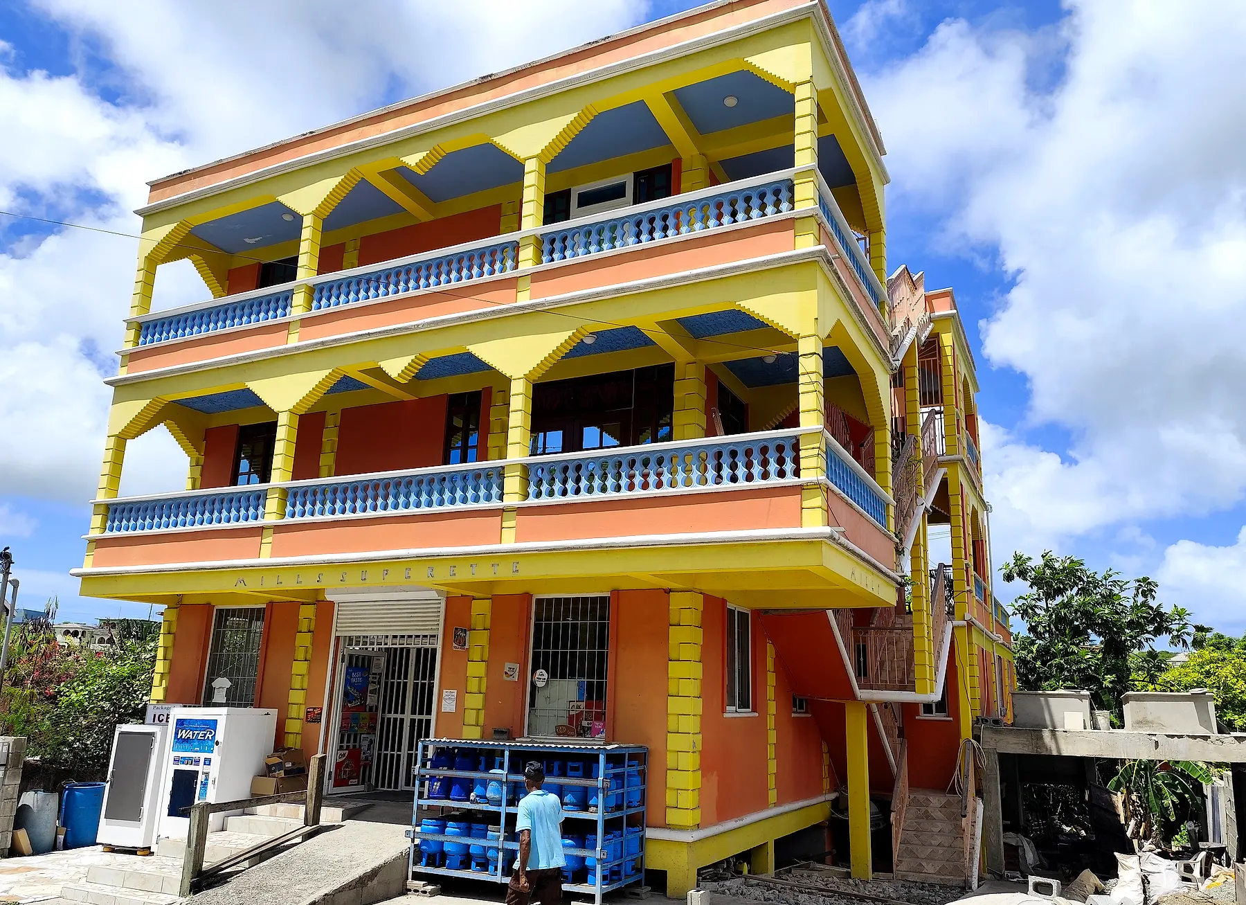 Casa Coral in Grays Farm - Mills Superette at street level with the apartments stacked above it