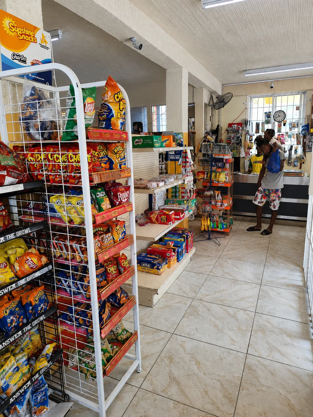 A stocked aisle inside Mills Superette on the ground floor