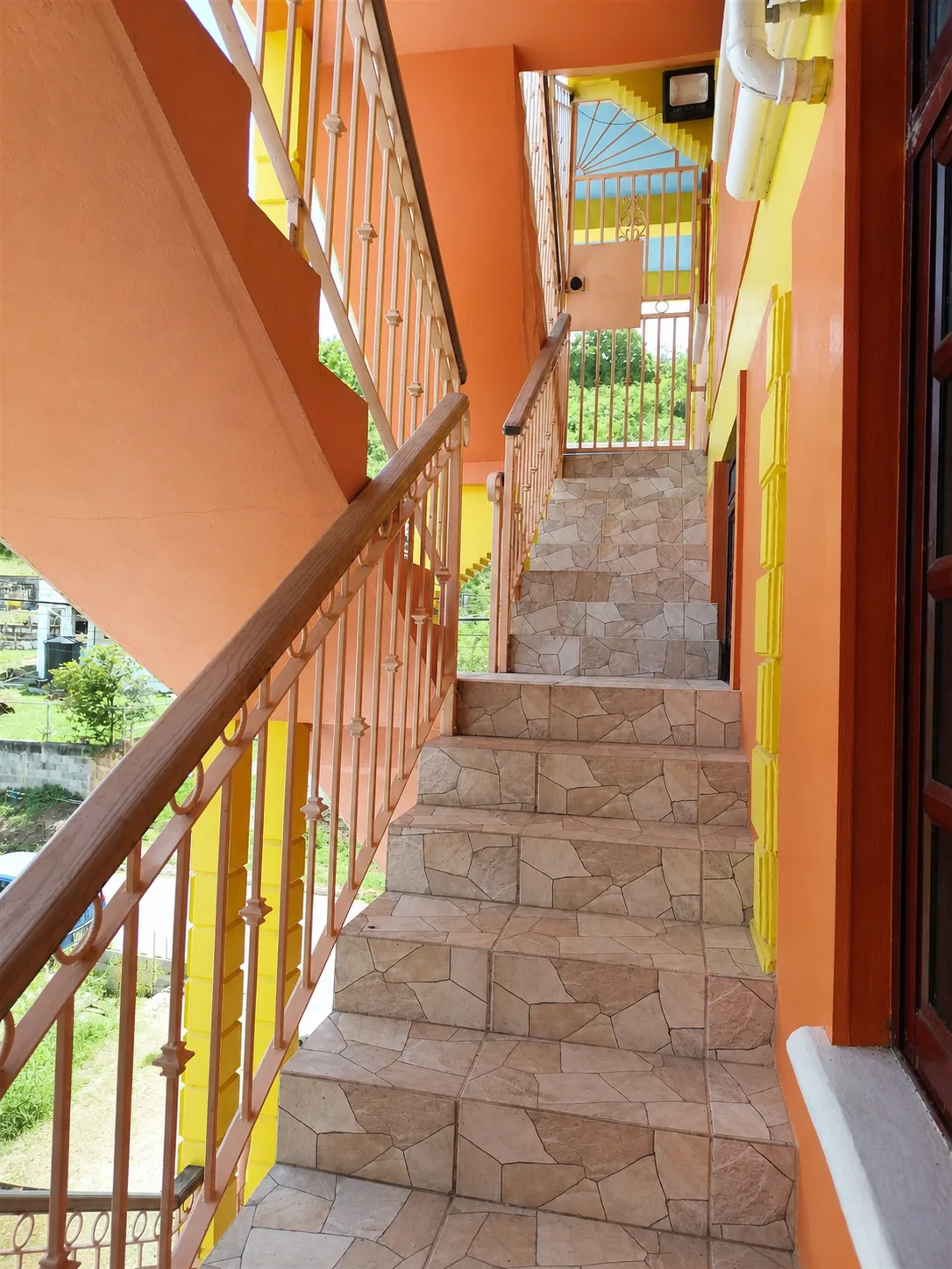 The landing outside the apartments, looking toward the stairs